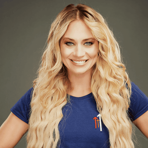 Headshot of Kimberly Wyatt in a stand up to cancer t shirt.