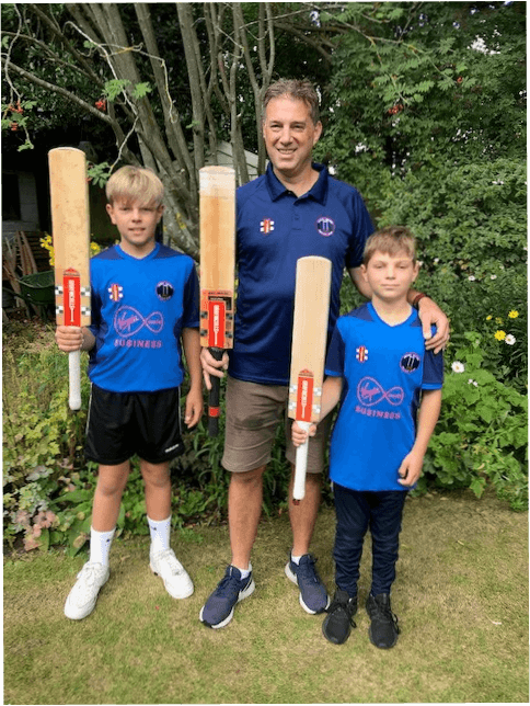 Clint and his sons with a cricket back