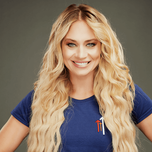 Kimberly Wyatt looking straight ahead smiling wearing a dark blue Stand Up To Cancer t-shirt