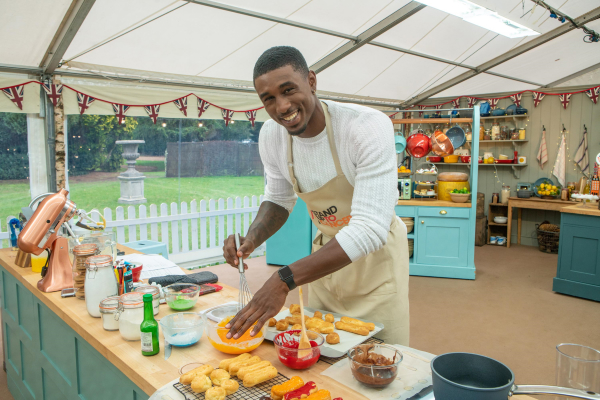 Ovie Soko baking on the Great Stand Up To Cancer Bake Off