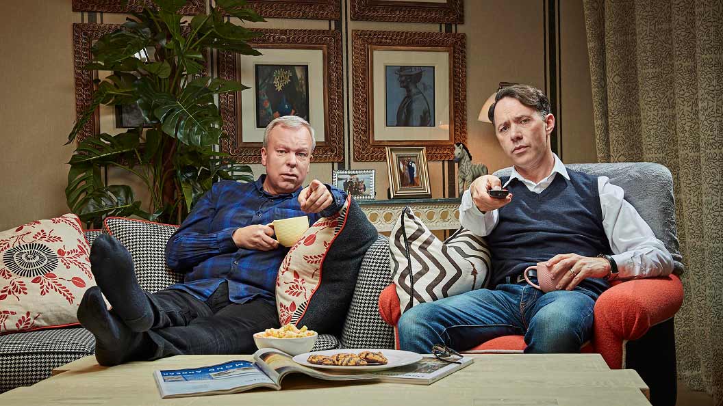Steve Pemberton and Reece Shearsmith point towards the screen while watching Celebrity Gogglebox on for Stand Up To Cancer