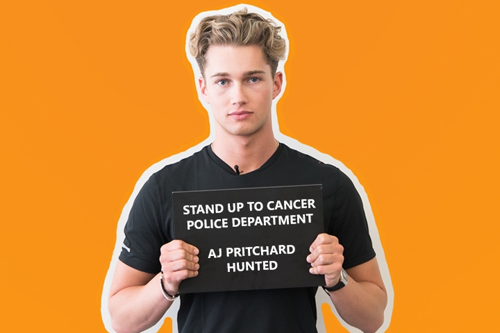 AJ Pritchard in Hunted holding up board
