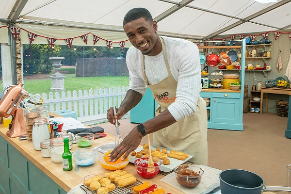 Ovie Soko whisking eggs in the Bake Off tent