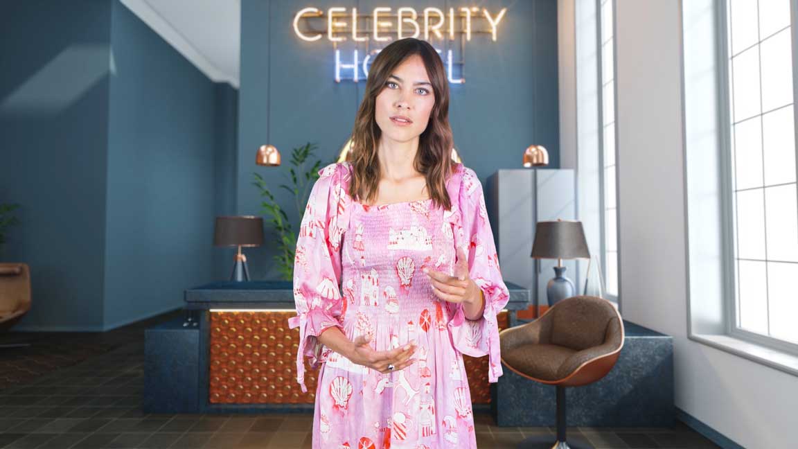 Alexa Chung talking in Stand Up To Cancer Quiz in a hotel lobby in a pink dress