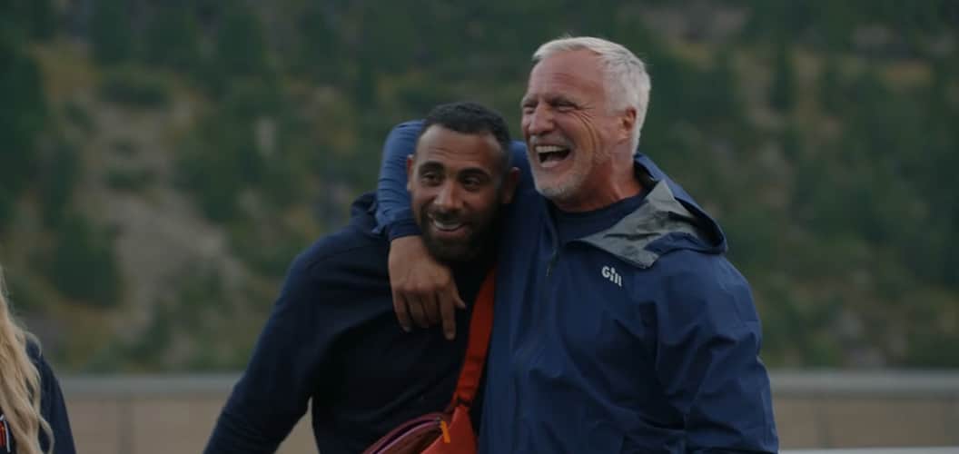 Two members of the cast of Don't Look Down for Stand Up To Cancer hugging.