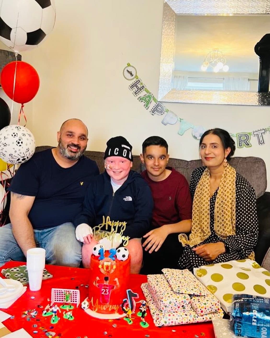 Image of Yuvraj and family celebrating a birthday.